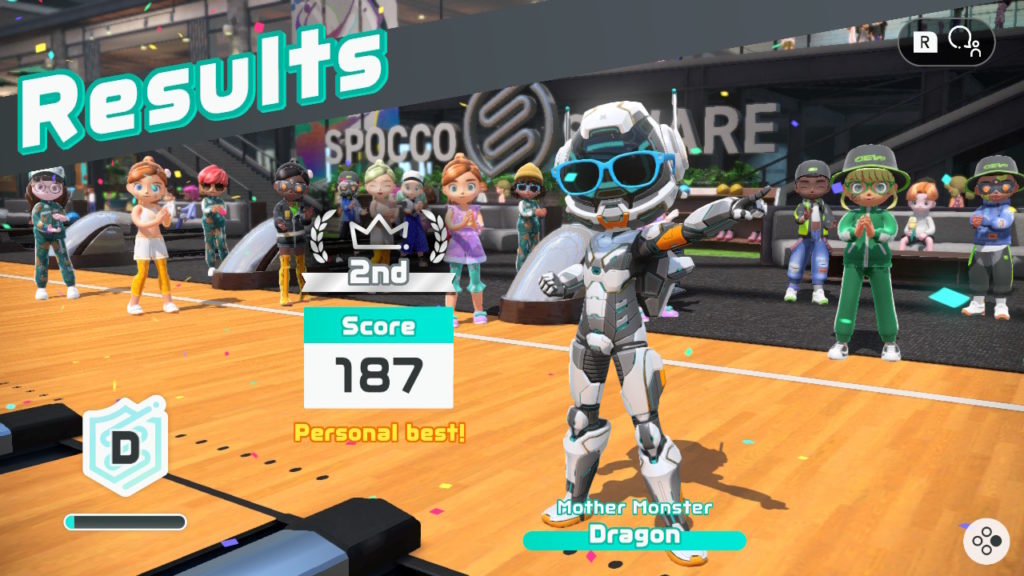 Winning screen showing a robot in front of people in a bowling alley. 